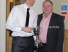 Paul Doherty accepts the Gerry Dalrymple Memorial Cup for Senior Footballer of the year from Joe Dalrymple